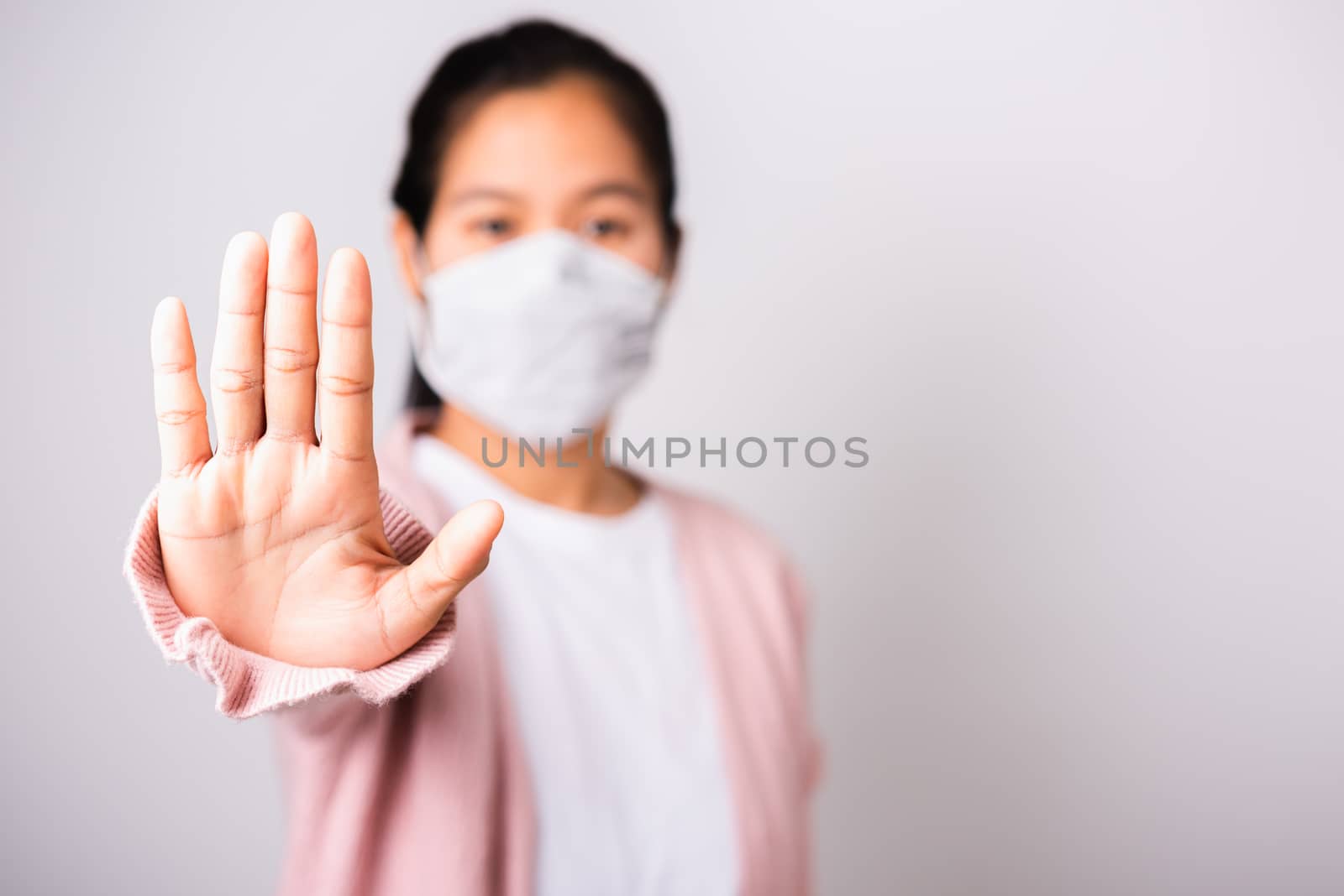 woman wearing surgical protection face mask hygiene against coro by Sorapop