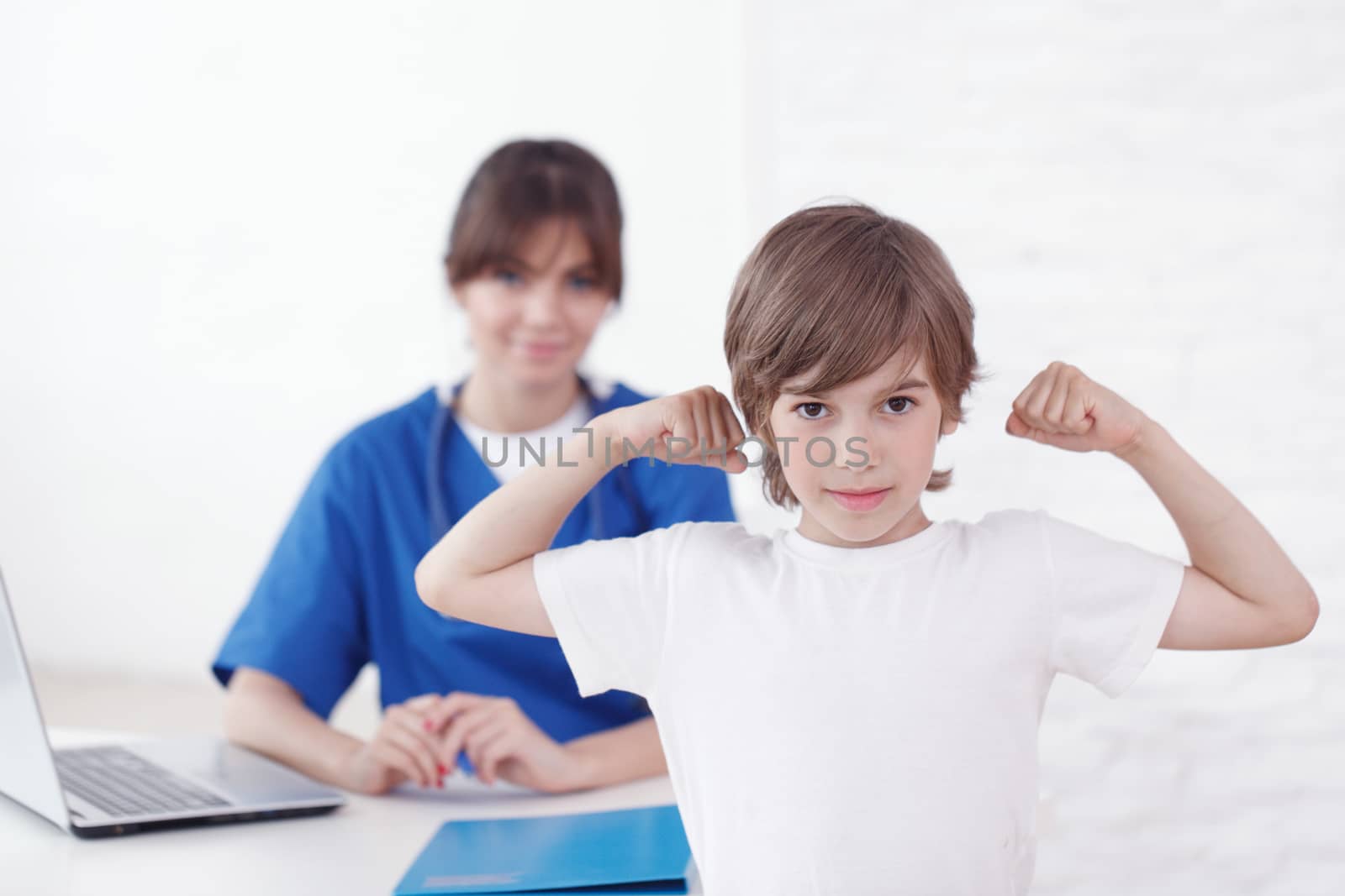 Healthy child at pediatrician office by ALotOfPeople