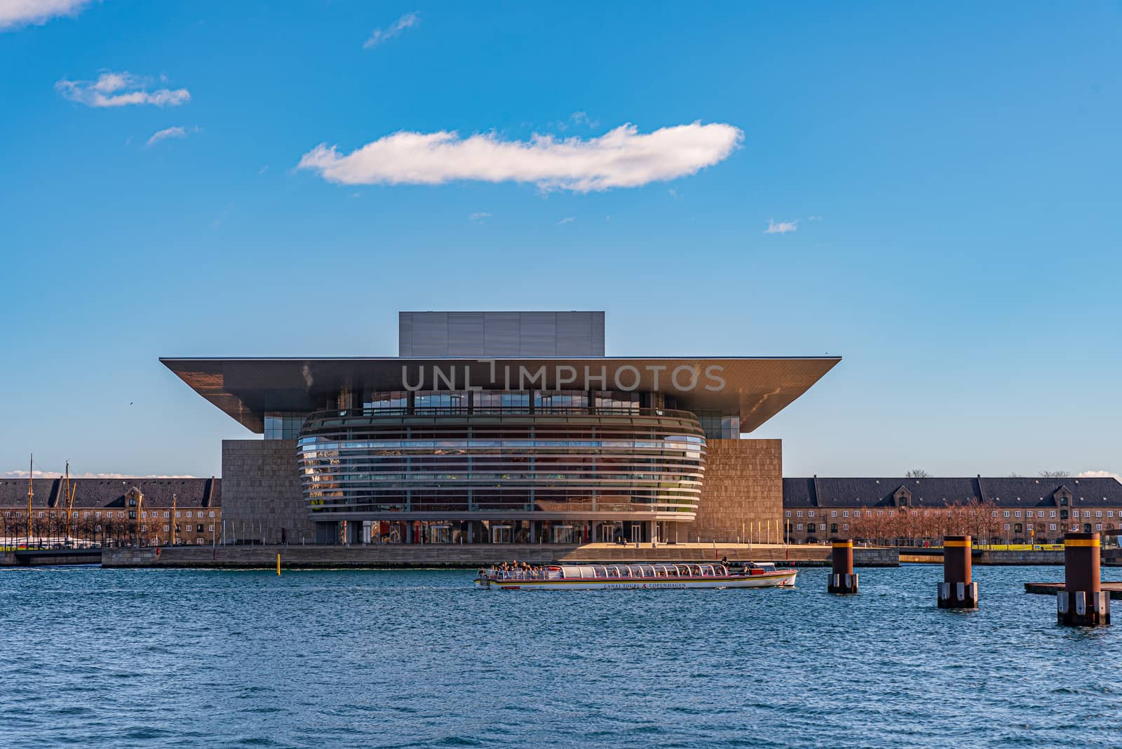 Copenhagen Opera House at dusk, horizontal image of building on water, contemporary European architecture