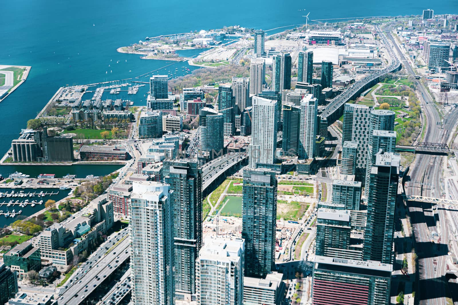 Aerial views of Toronto downtown and harbor shot from the top of CN Tower, Canada. by sonandonures