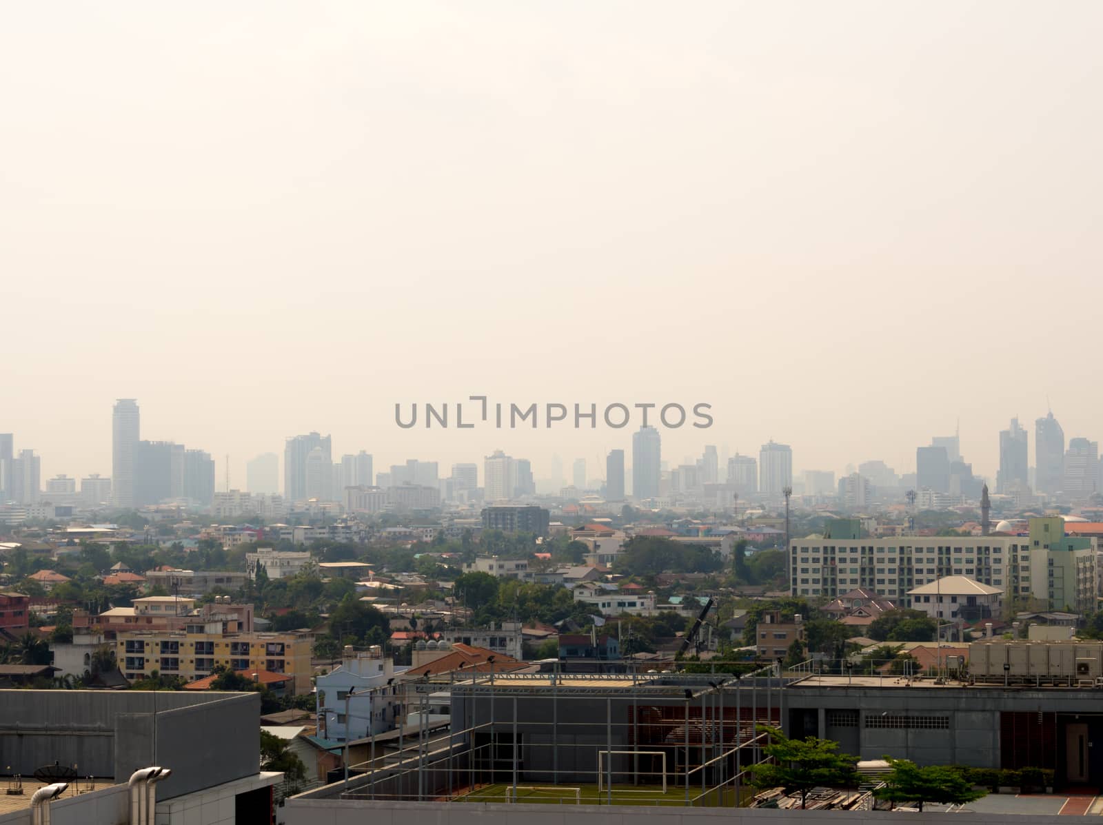 Cityscape urban skyline in the mist or smog. Wide and High view  by Satakorn