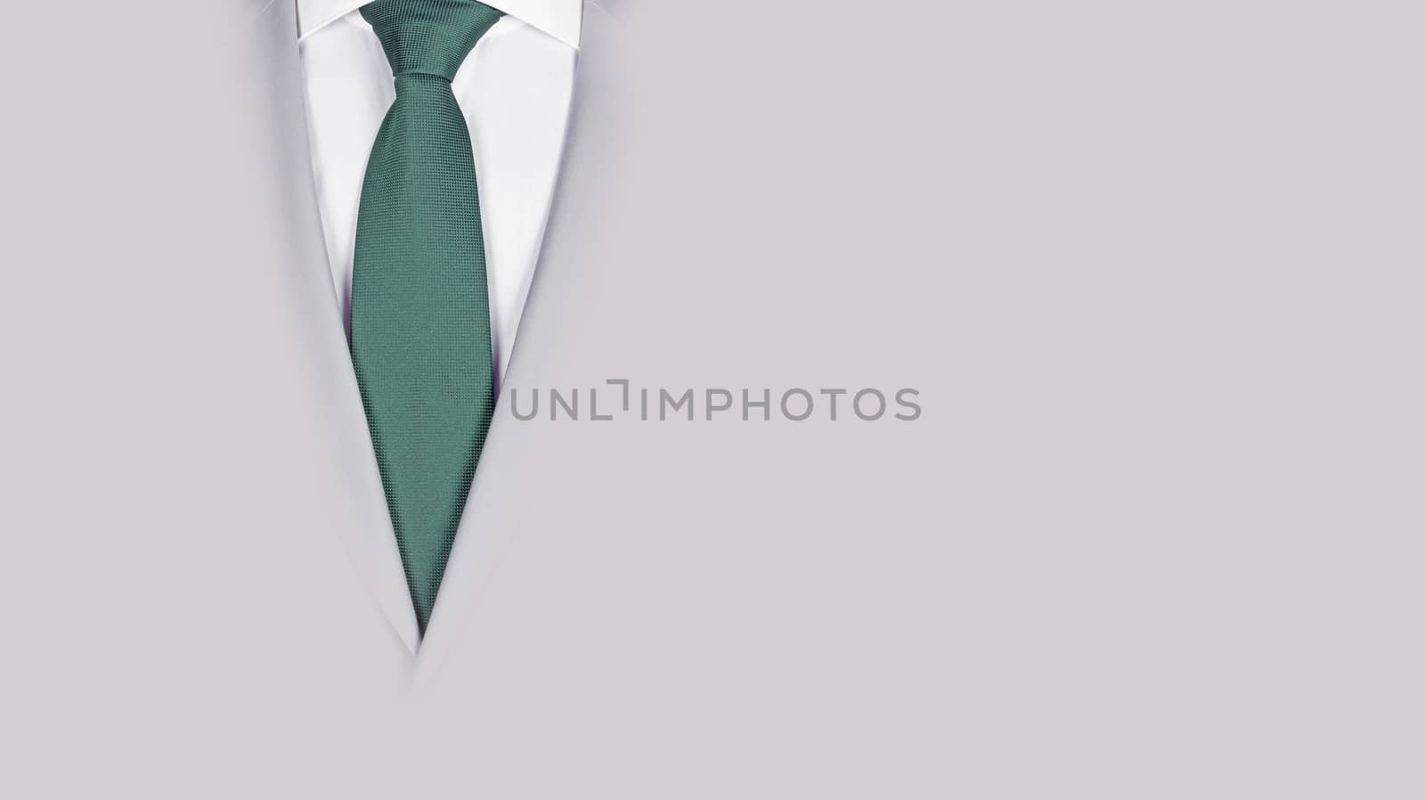 Man in a grey suit with green tie, close-up