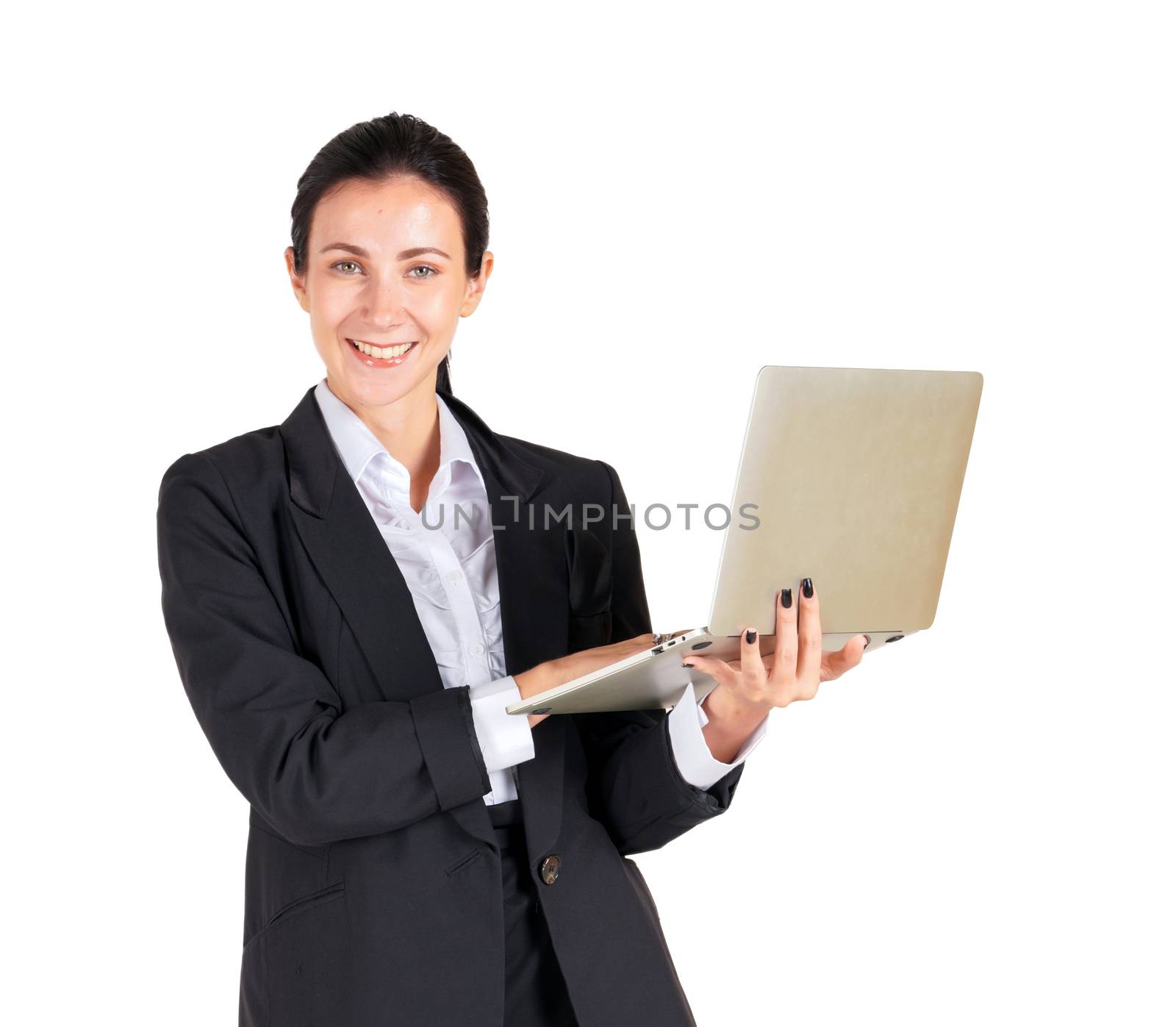 A business woman in a black suit typing on a computer notebook. by chadchai_k