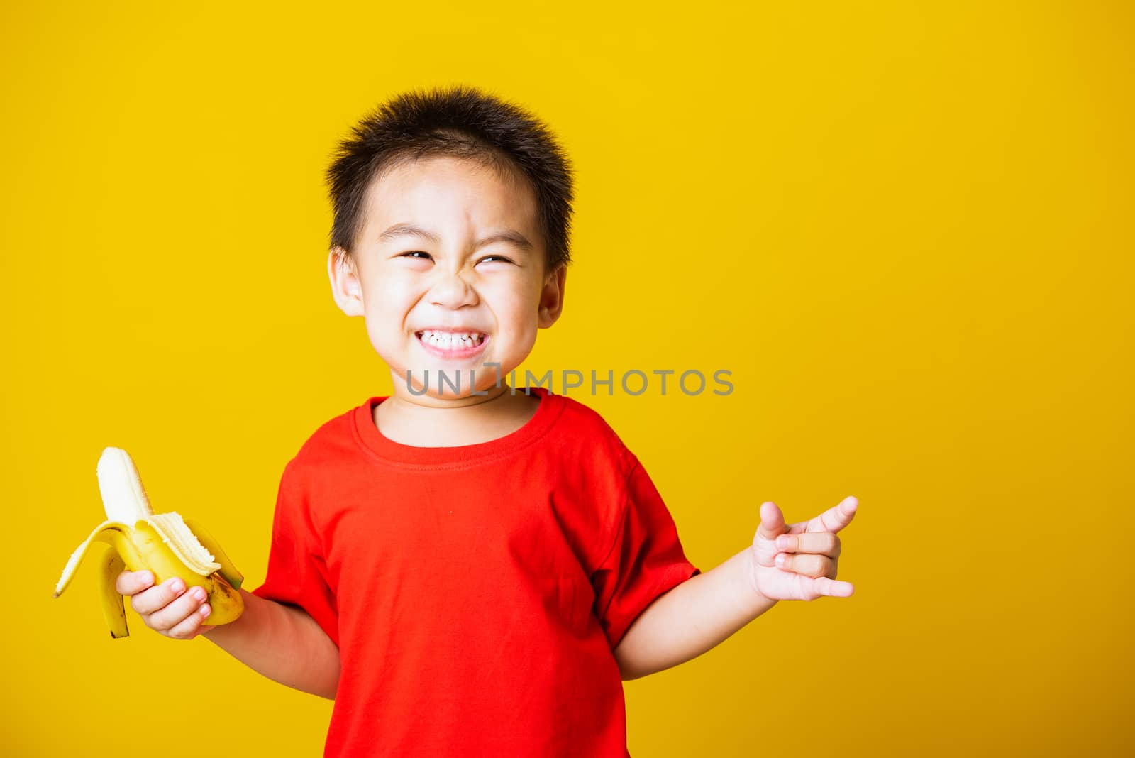 kid cute little boy attractive smile wearing red t-shirt playing by Sorapop