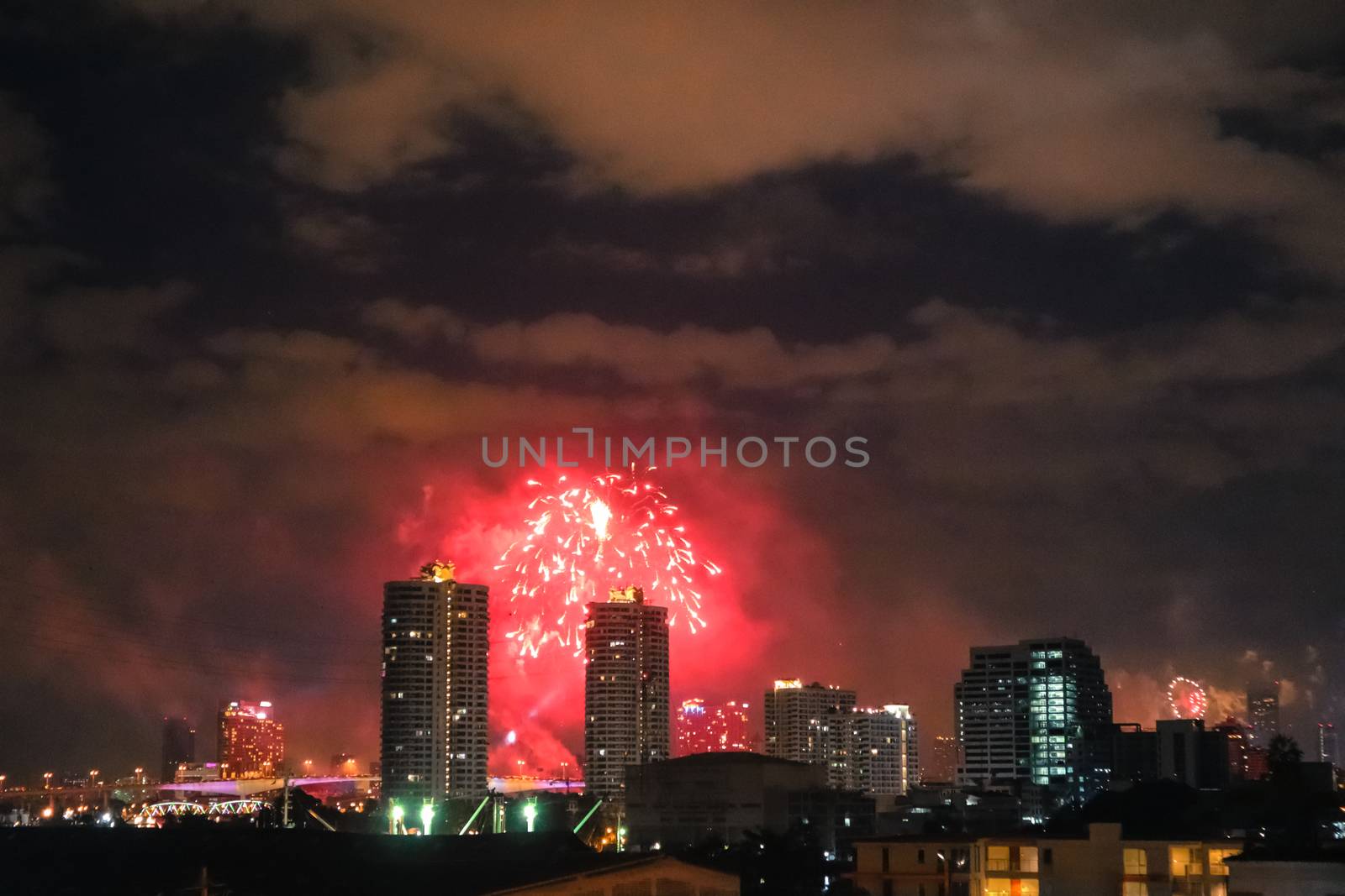 fireworks on Bangkok city skyline new years eve celebration