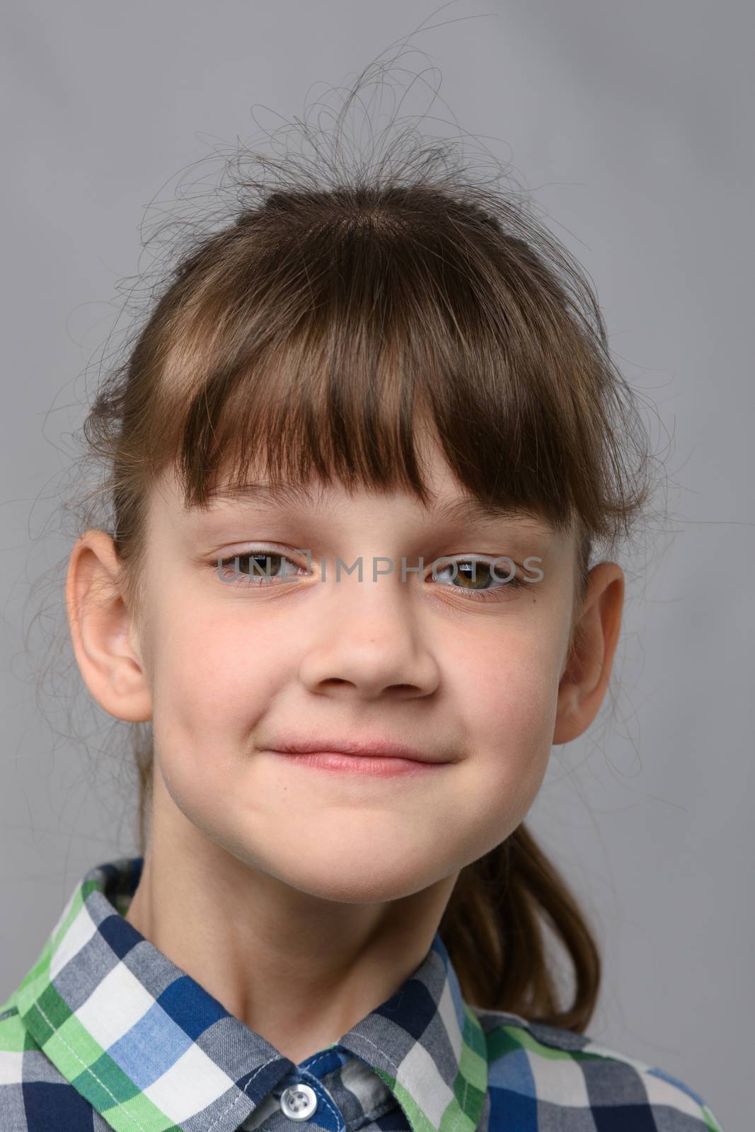 Portrait of a self-confident ten-year-old girl of European appearance, close-up