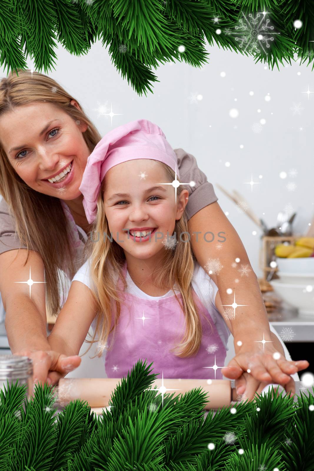 Composite image of a Mother and daughter baking Christmas cookies in the kitchen against snow falling