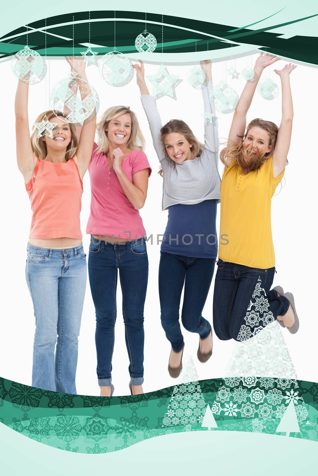 Smiling celebrating girls jumping up against christmas frame