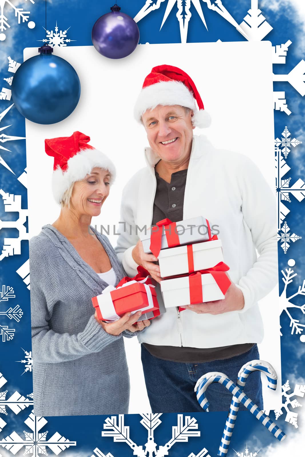 Festive mature couple in winter clothes holding gifts against christmas frame