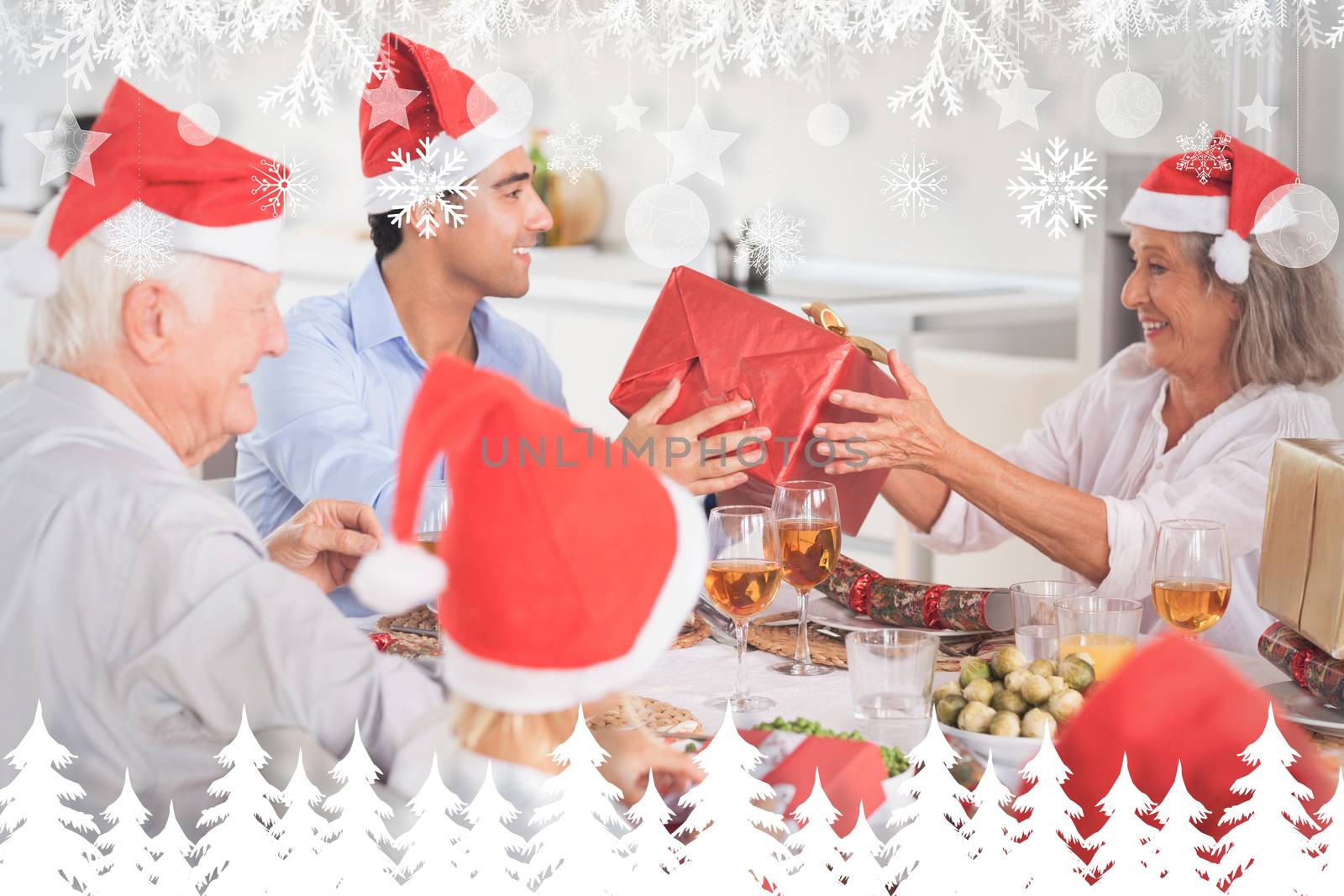 Composite image of happy family exchanging christmas gifts by Wavebreakmedia