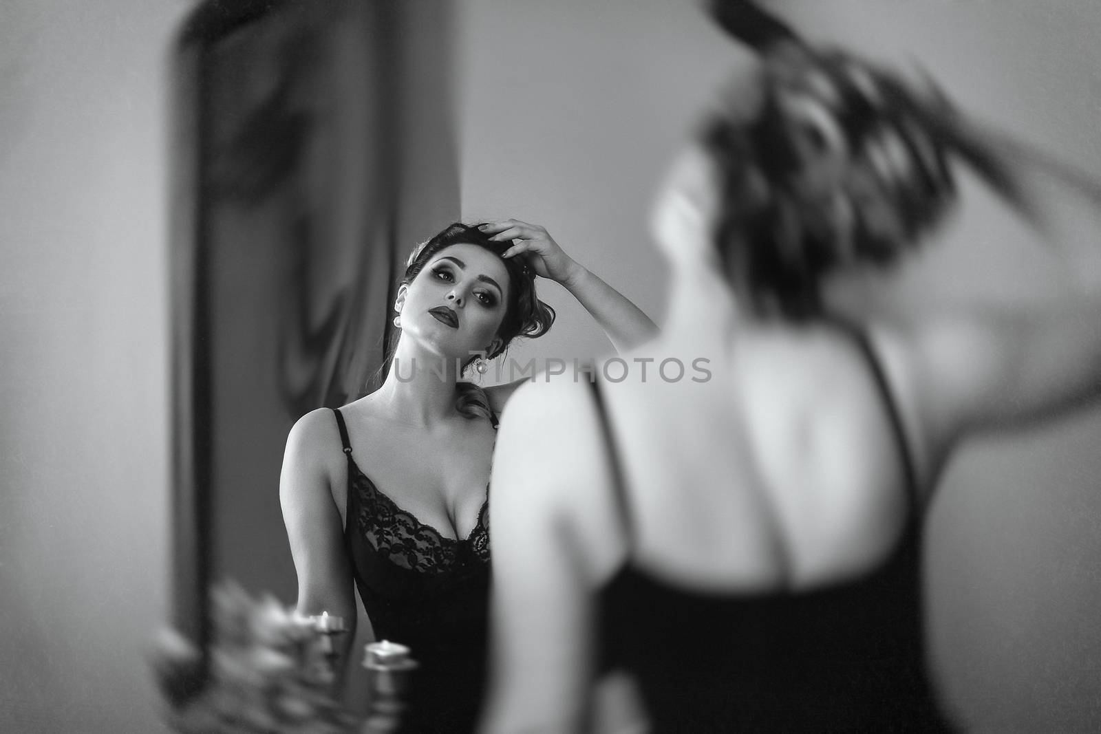 young brunette model girl and actress in front of a mirror, blac by Andreua