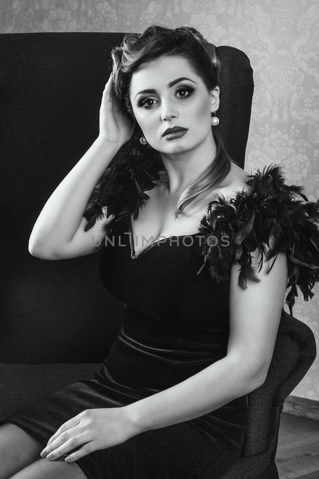 young brunette model girl and actress in a chair, black and white