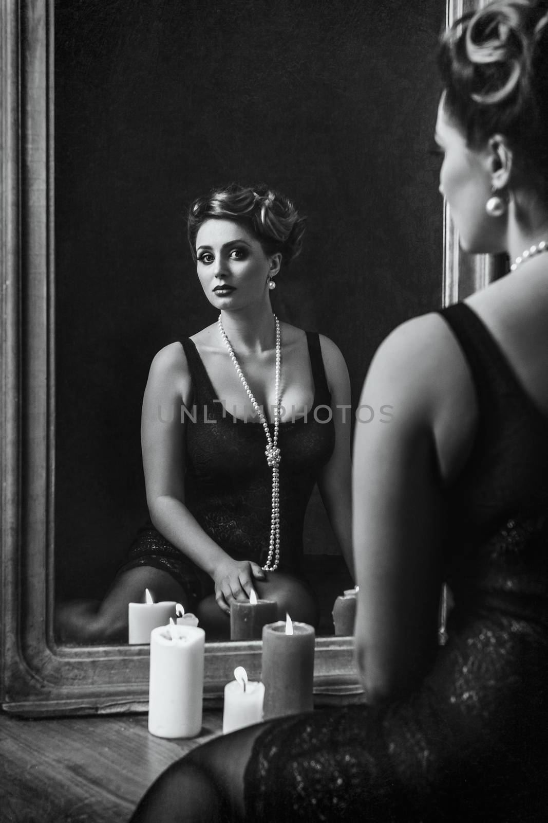 young brunette model girl and actress in front of a mirror, black and white