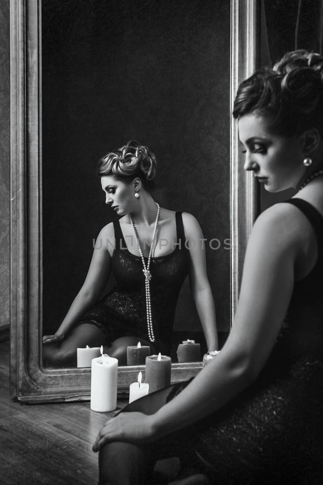 young brunette model girl and actress in front of a mirror, black and white