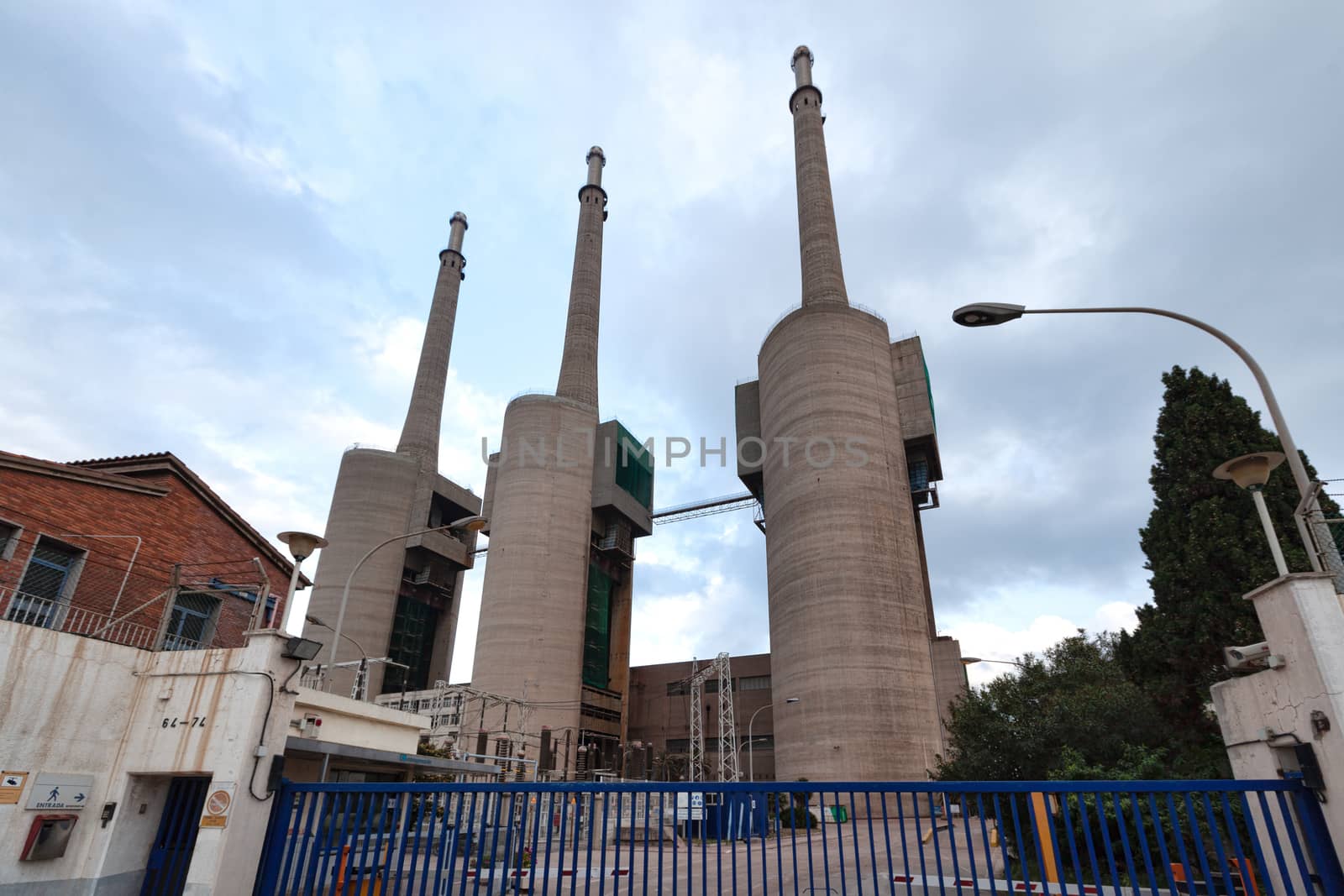 Barcelona, Spain - 12 May 2013: San Adrian thermal power plant (Central termica de San Adrian) also known as tres chimeneas