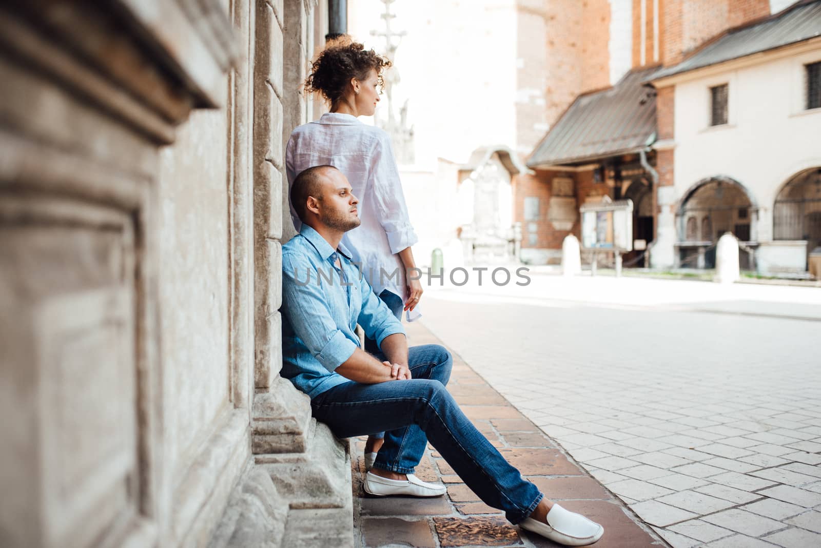 guy and a girl happily walk in the morning on the empty streets by Andreua