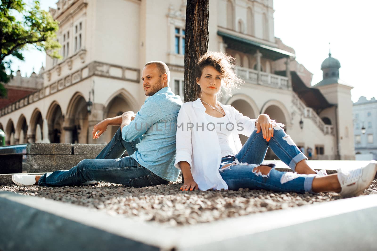 guy and a girl happily walk in the morning on the empty streets of old Europe