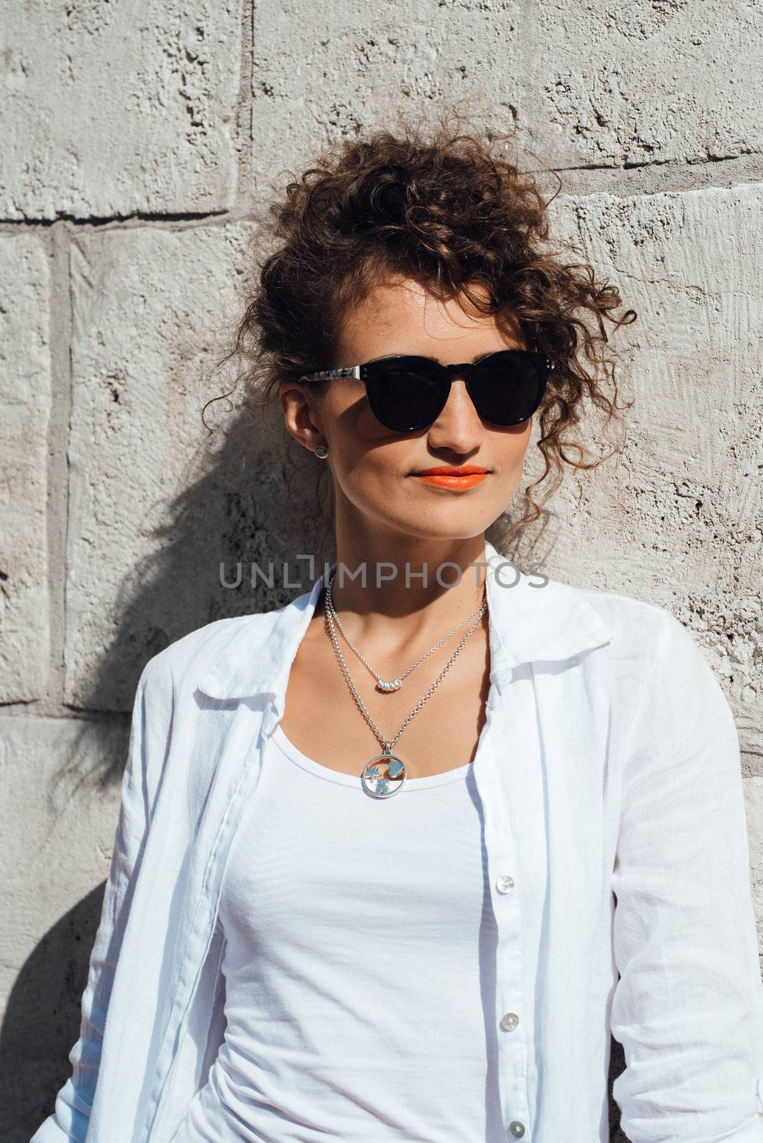 young girl walking on the old streets of europe by Andreua