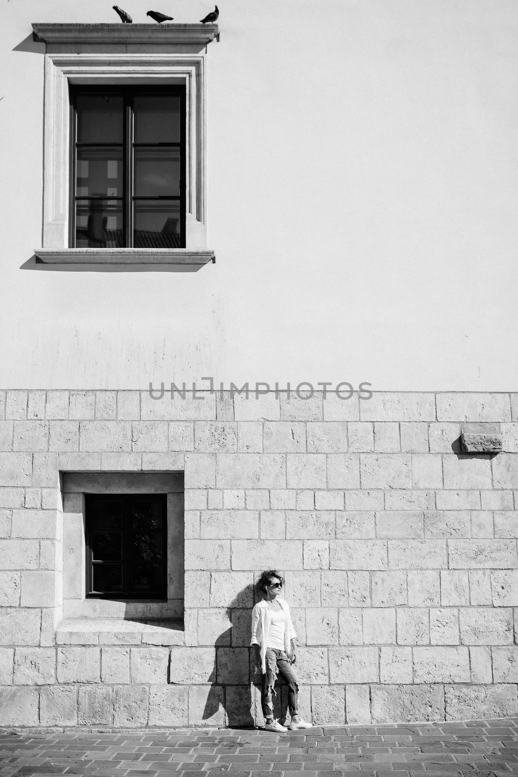 young girl walking on the old streets poland of europe