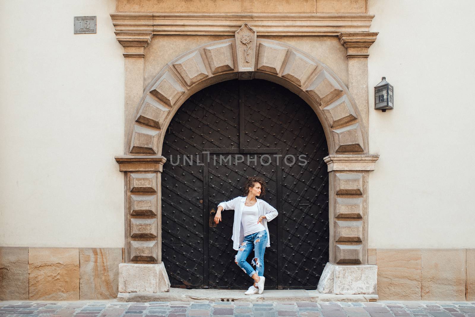 young girl walking on the old streets poland of europe