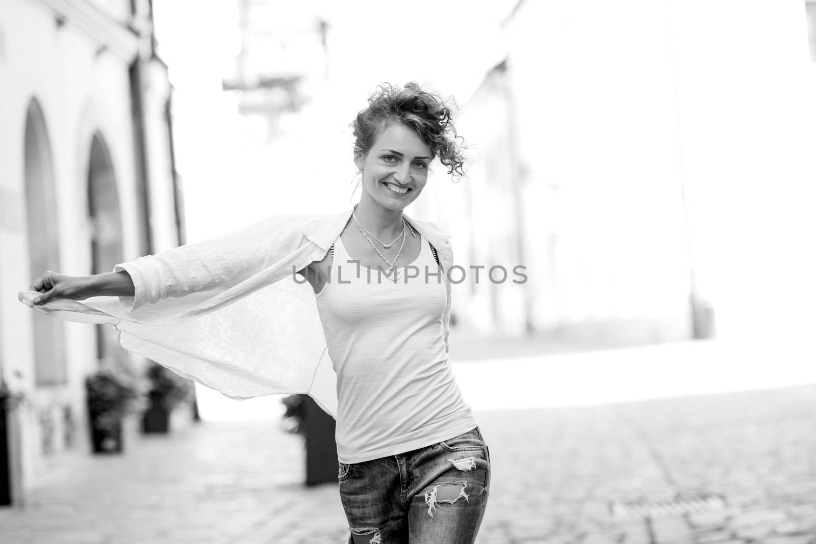 young girl walking on the old streets poland of europe