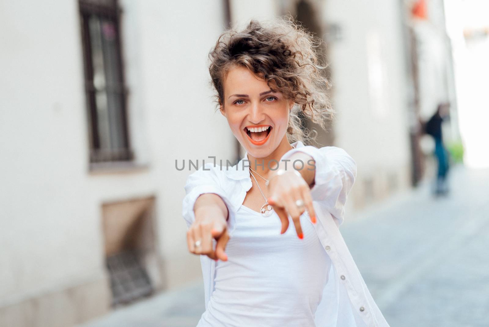 young girl walking on the old streets of europe by Andreua