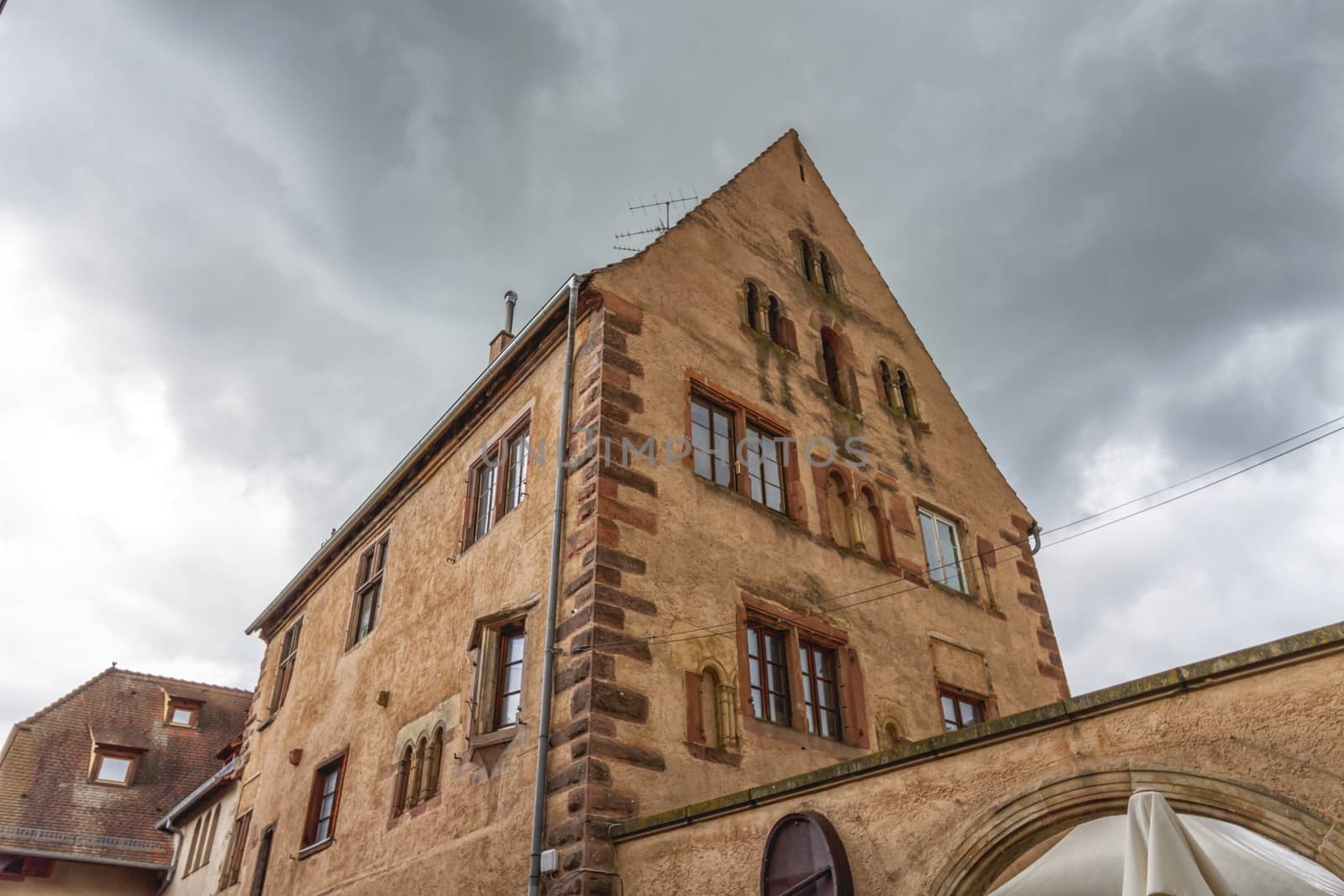 Romanesque house of the Rathsamhausens at street of Pelerins 8 by day, Obernai, Alsace, France