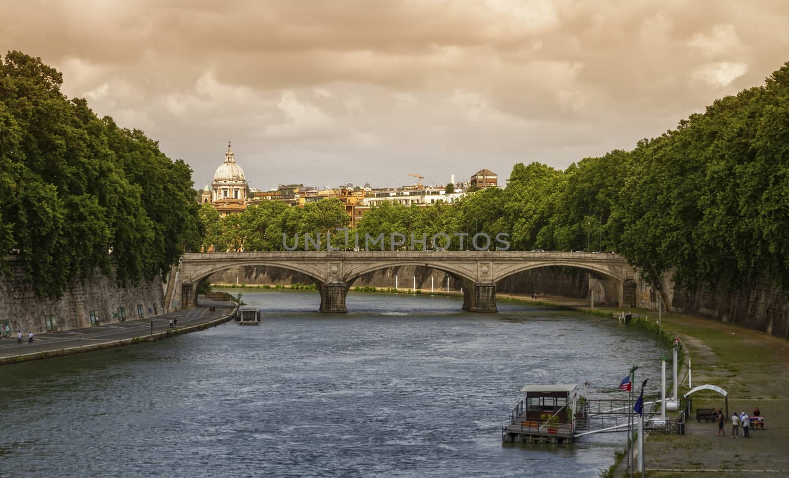 Bridge on the river Tiber and dome of St. Peter's Basilica in Rome, Italy by Elenaphotos21