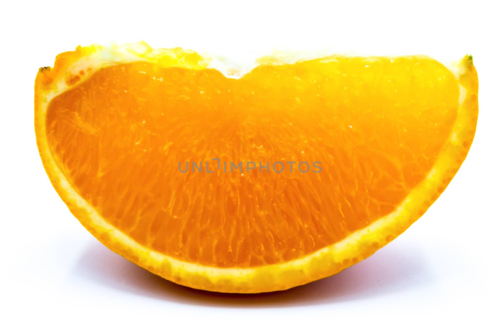 Close-up of an orange wedge on a white background