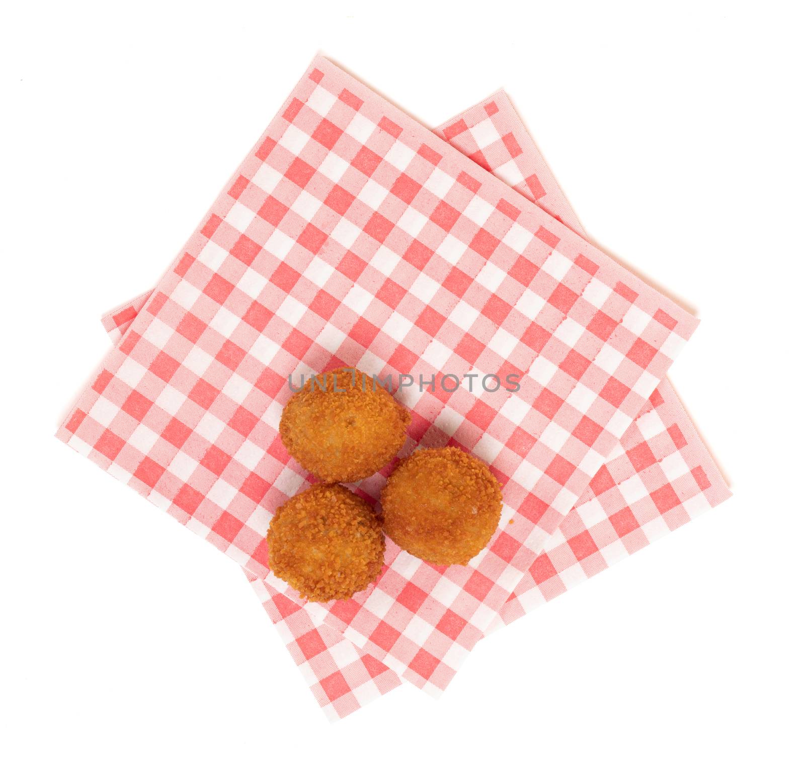Dutch traditional snack bitterbal on a red and white napkin by michaklootwijk