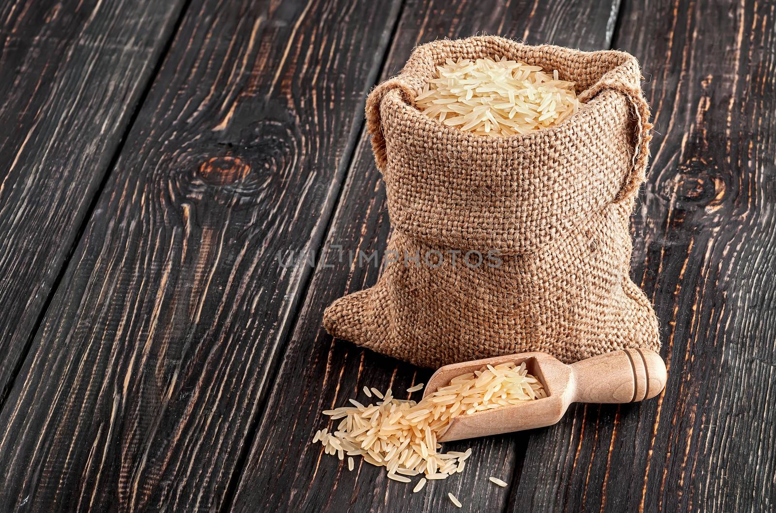 Bag with rice and spoon stands by Cipariss