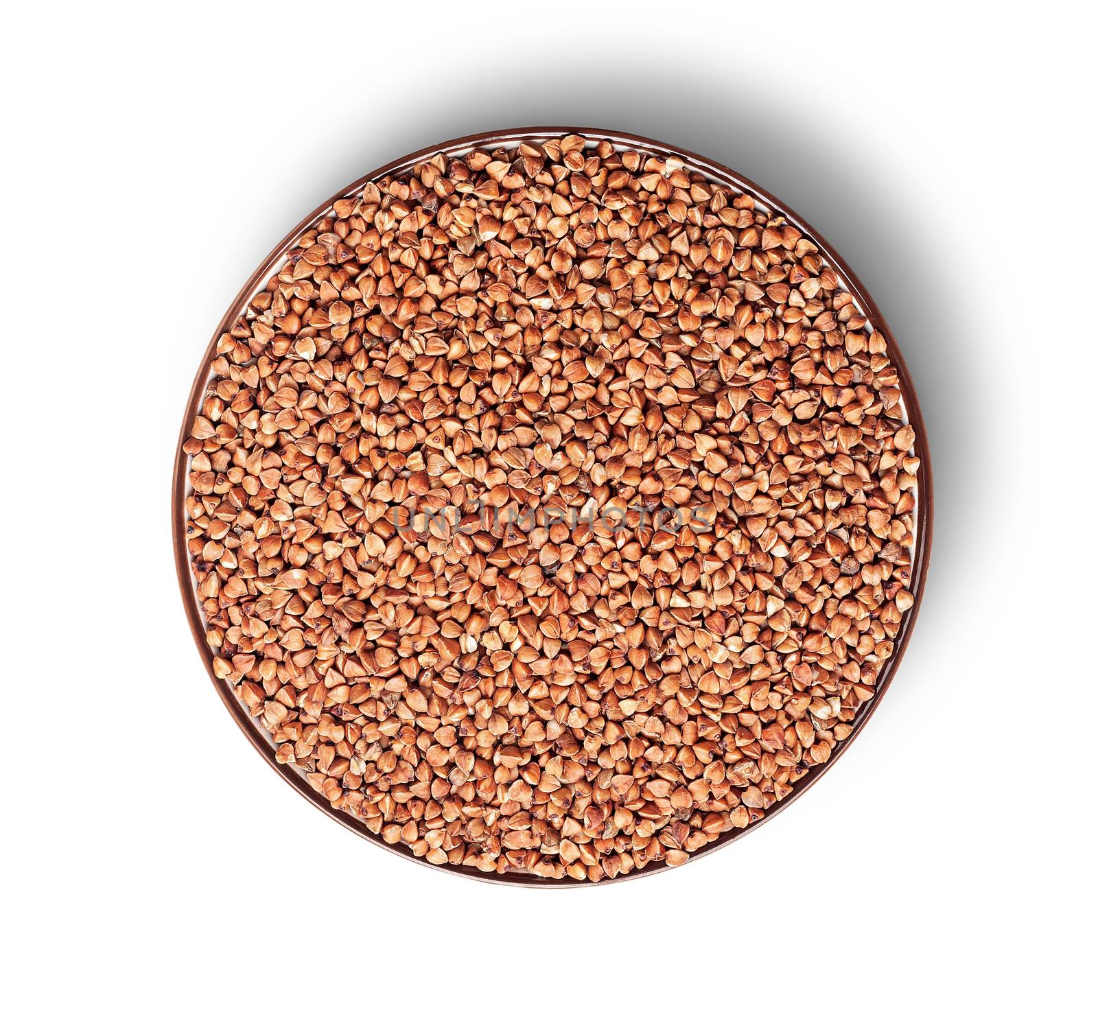 Buckwheat in a bowl from above isolated on a white background