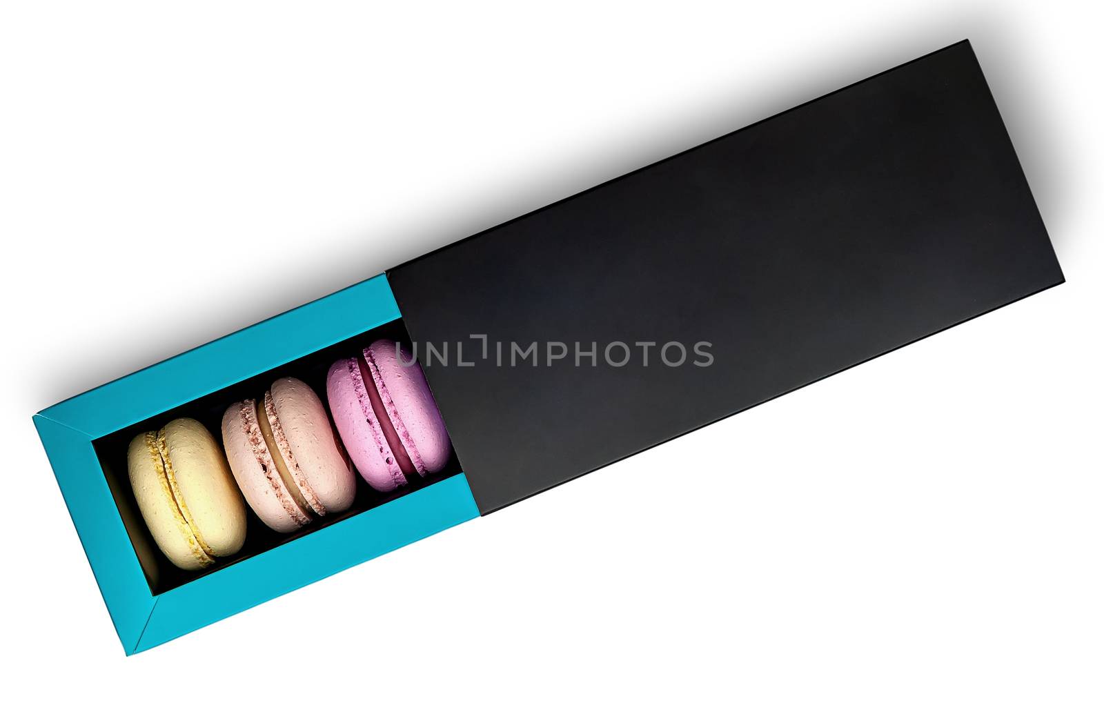 Colorful macaroon in box top view on white background
