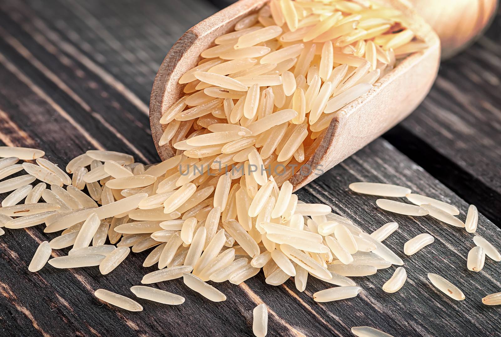 Long rice in scoop closeup by Cipariss