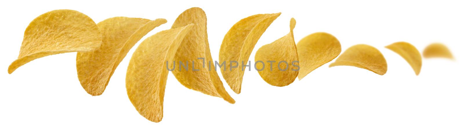 Potato chips levitate on a white background.