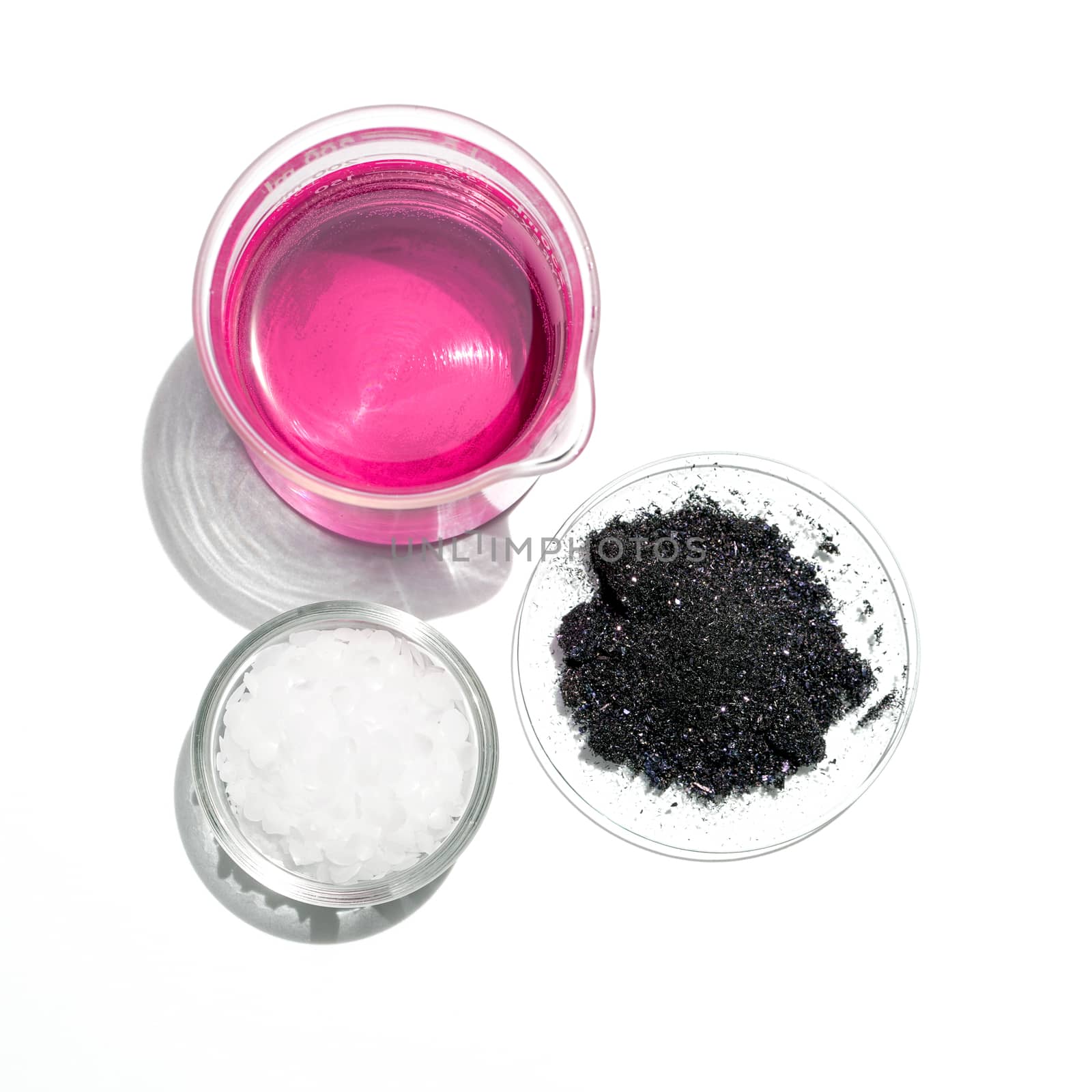 Cosmetic chemicals ingredient on white laboratory table (Top View). Potassium Permanganate Liquid, KMnO4, Microcrystalline wax. 