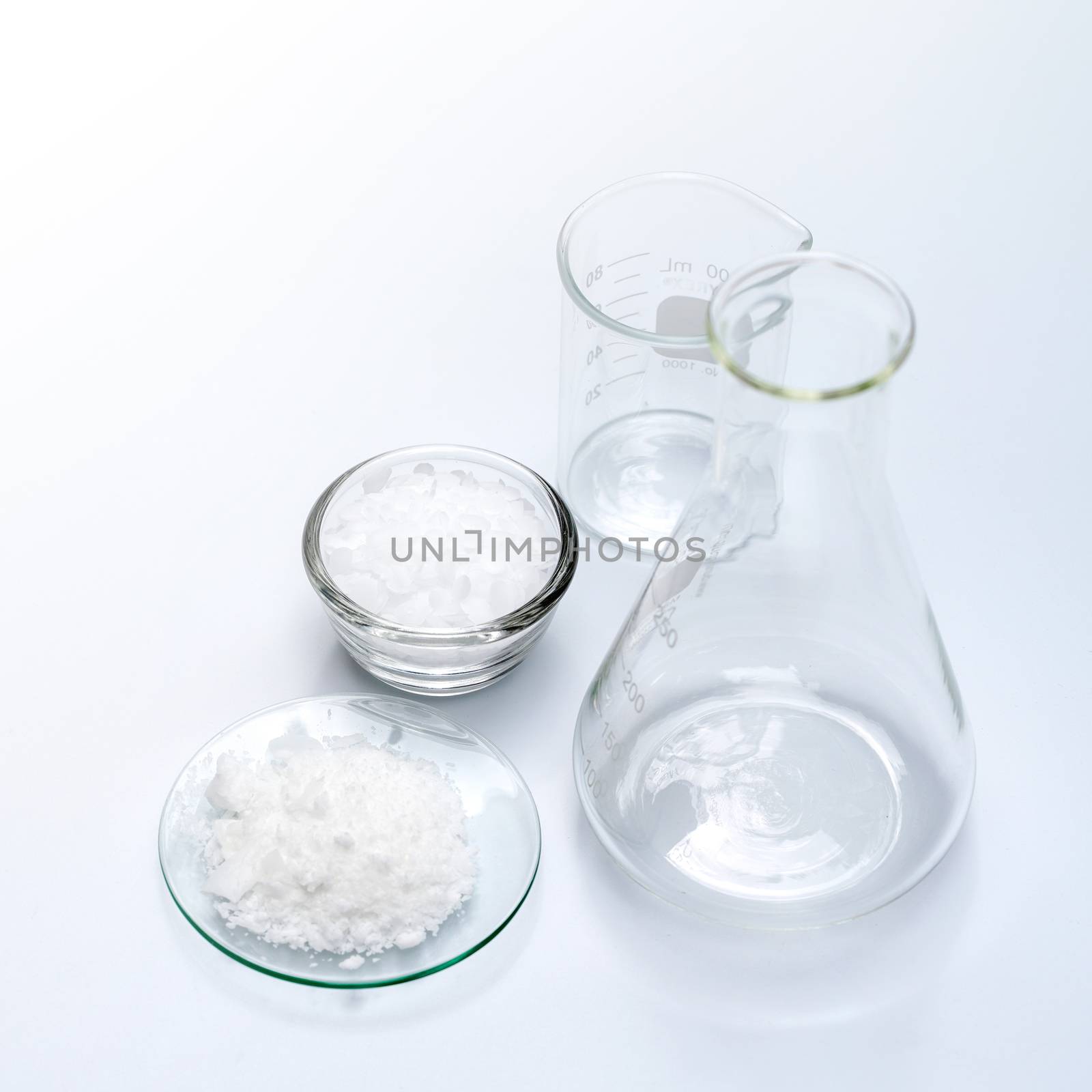 Cosmetic chemicals ingredient on laboratory table. Microcrystalline wax, Potassium chloride (KCl). 
