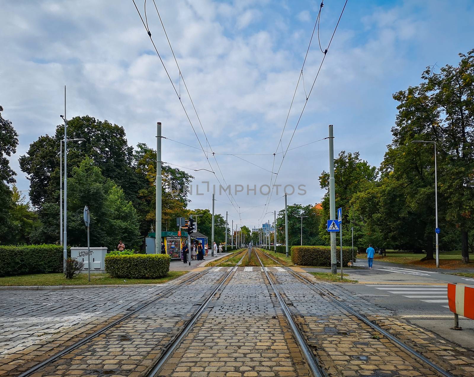 Street view from tram rails to tram station roundabout in Wroclaw city by Wierzchu