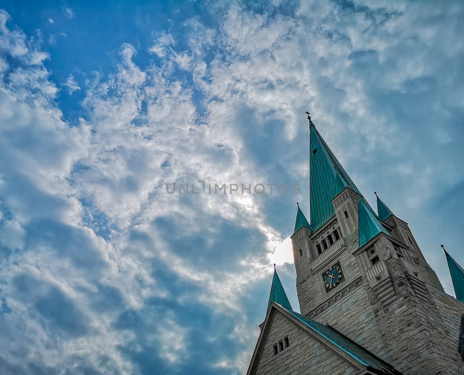 Tower of old Cathedral building in Wroclaw City with beautiful cloudy sky as background by Wierzchu