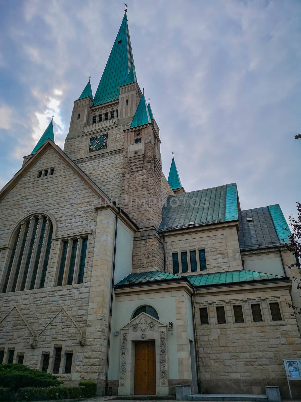 Old white Cathedral building with aquamarine towers in Wroclaw City