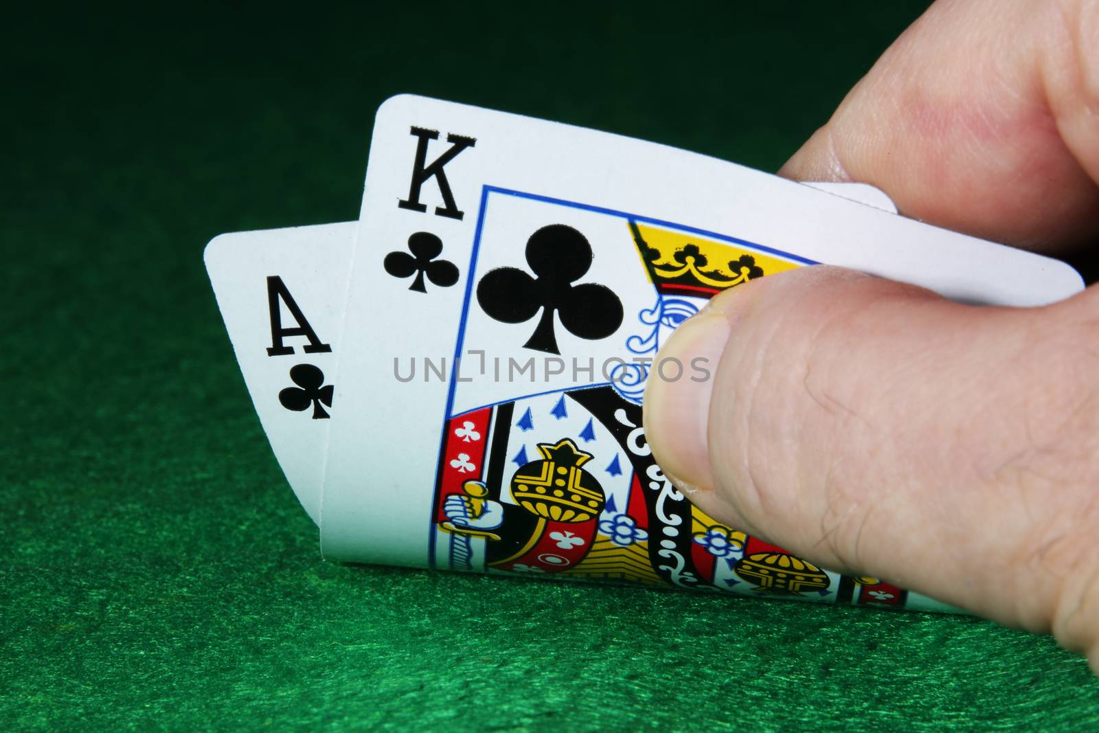 Checking the draw Ace King of Clubs cards poker