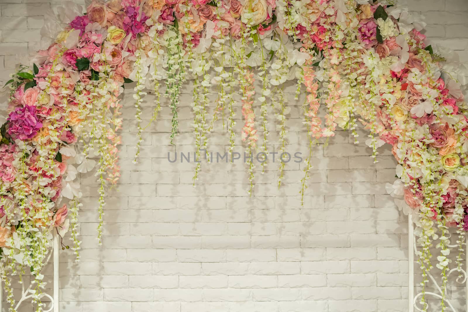 Wedding arch with flowers for the wedding ceremony. Wedding flower background