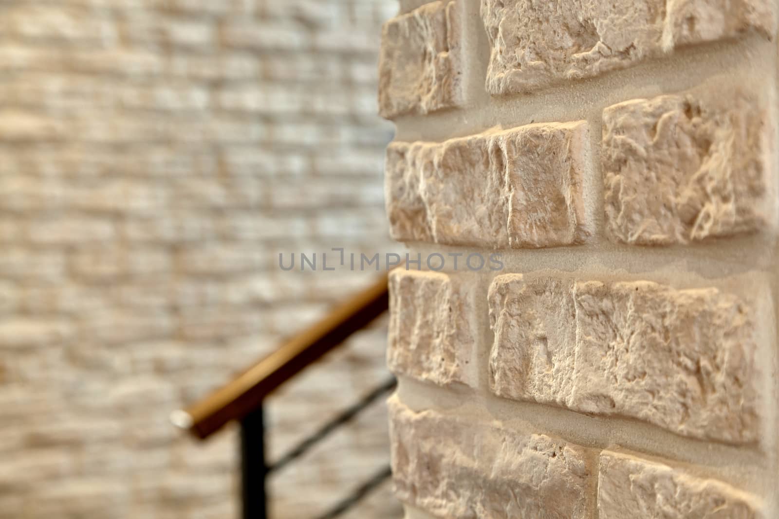 A fragment of the wall lined with white brick. Brick background.