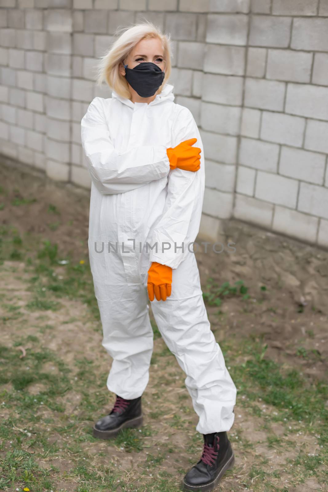 Woman in black mask, white protective suit and gloves by Angel_a