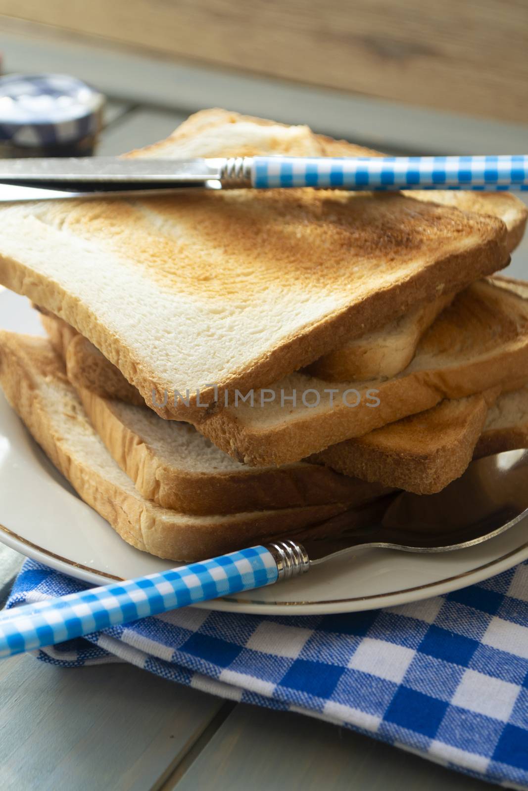 slices of rye dry bread as toast for breakfast with vintage knife. Vertical image