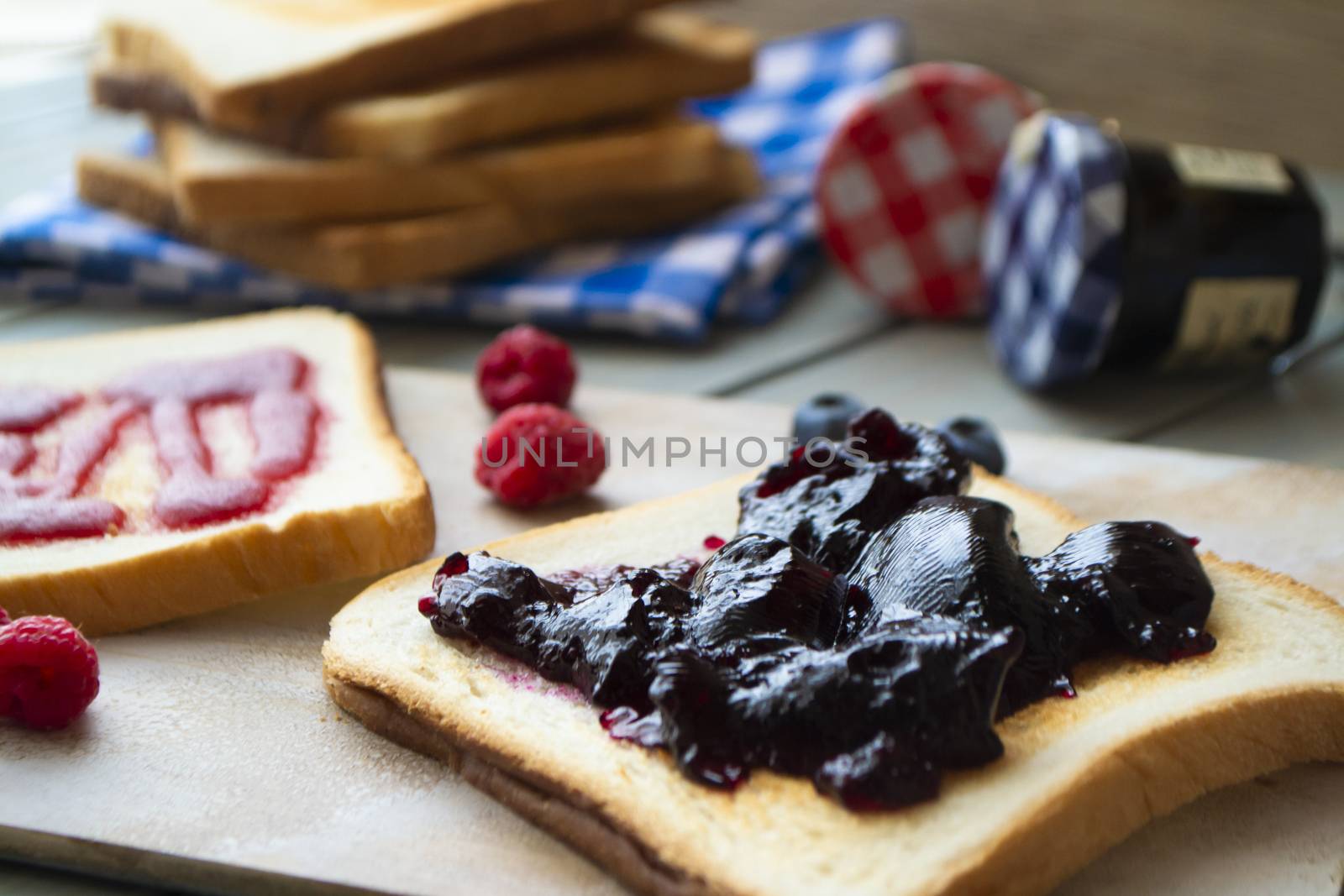 French cinnamon toast with blueberries, raspberries, maple syrup. morning breakfast, close up