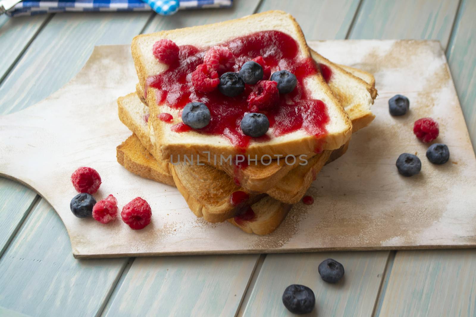 French toast with jam and berries, rustic and vintage