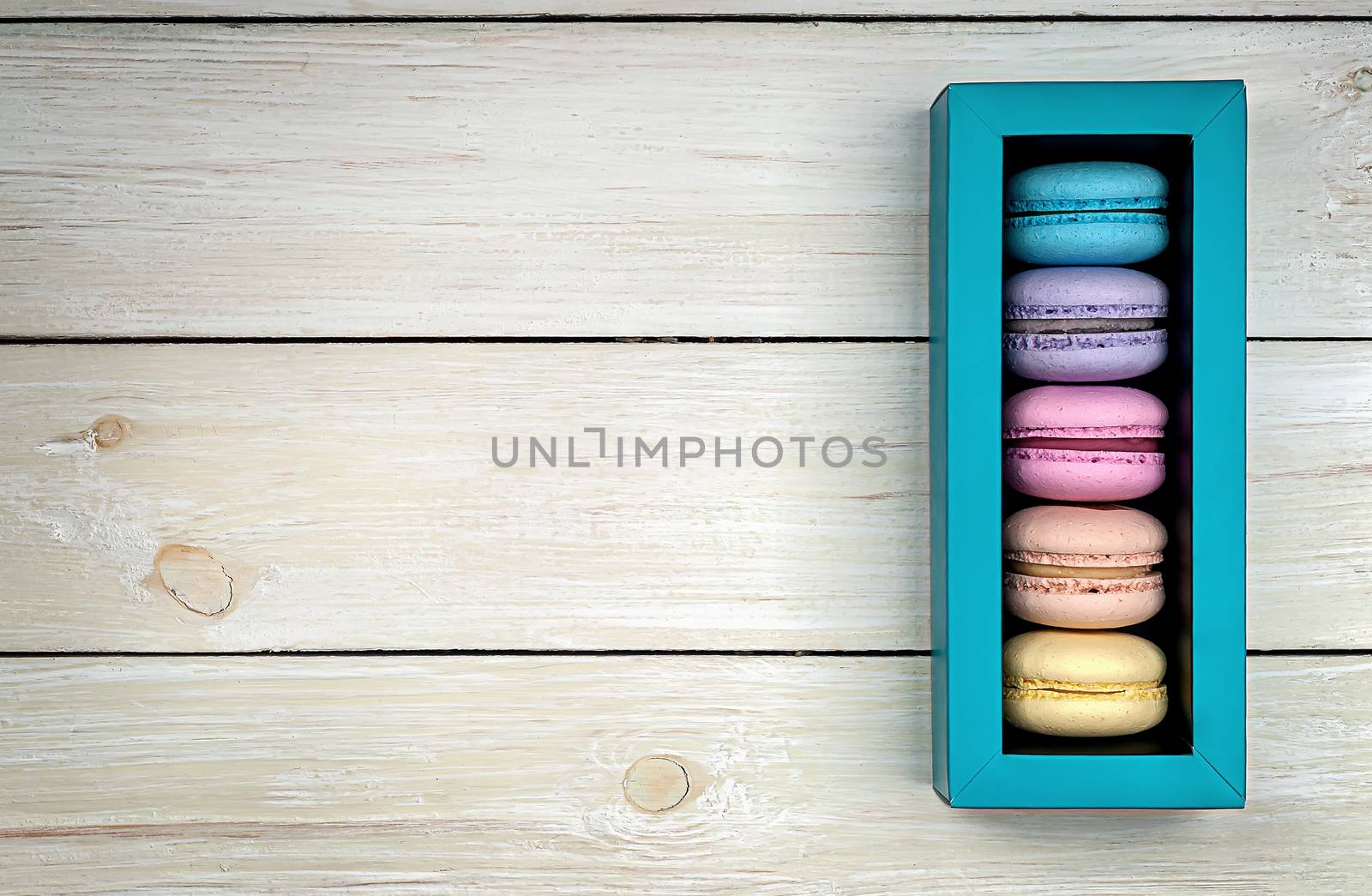 Multicolored macaroons in gift box by Cipariss