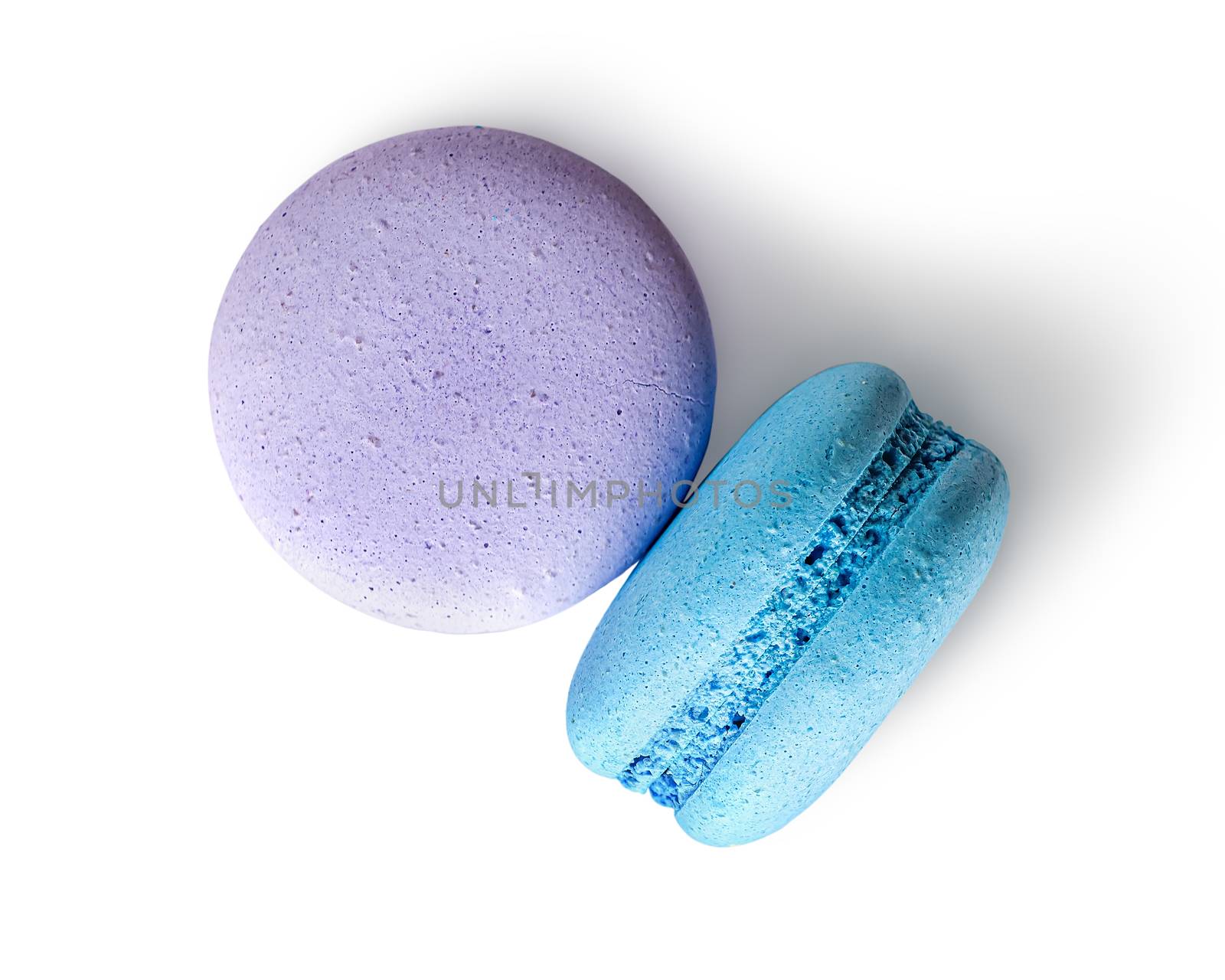 Two macaroon purple blue top view on white background