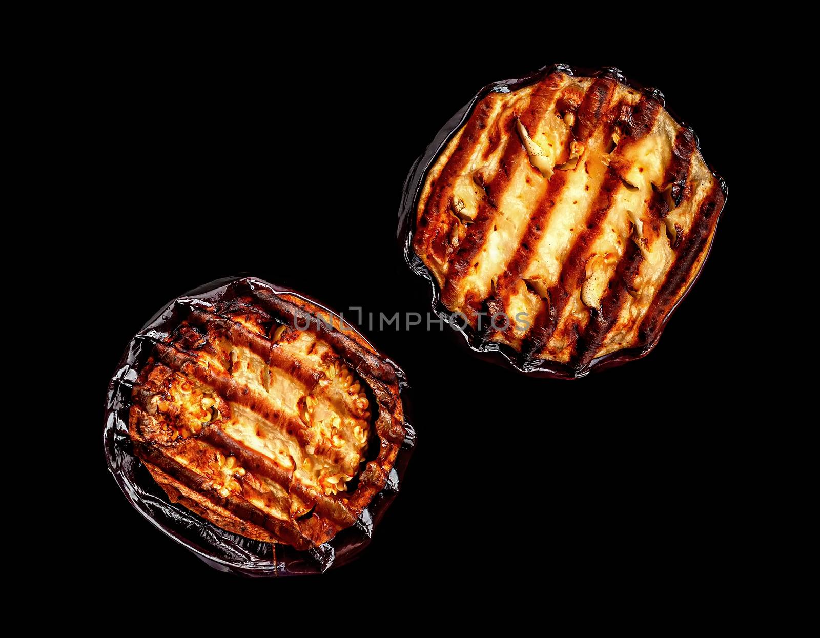 Two pieces of grilled eggplant by Cipariss